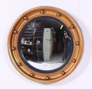 A 1950's regency style convex circular w