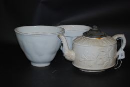 A 19th century biscuit ware teapot with