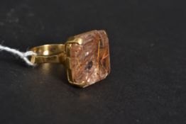 An 18ct gold cushion cut stone cocktail