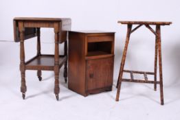 A 1930's walnut bedside cabinet together