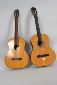 Two acoustic Spanish style six string gu