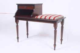 A Regency style mahogany telephone table