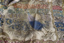 A large ornate silk decorated throw havi