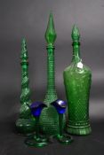 A collection of three green glass arabic