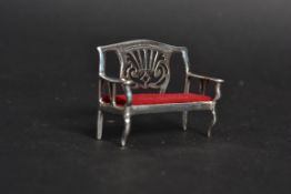 A white metal 925 silver bench with seat