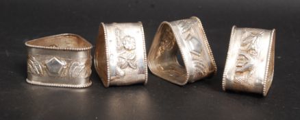 A set of 4 sterling silver marked napkin