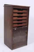 A 1950's pedestal oak tambour office fil