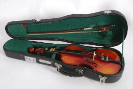 A cased students violin by Skylark along