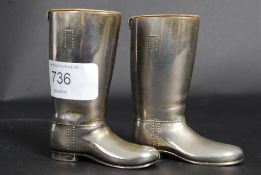 A pair of heavy silver plated drinks mea