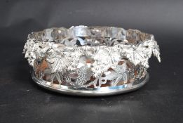 A large silver plated grape and vine bot