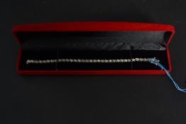 A 14ct yellow gold diamond tennis bracel