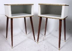 A pair of 1950's vinyl upholstered bedsi
