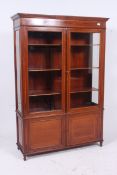 A large Edwardian mahogany inlaid displa