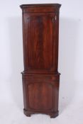A good quality flame mahogany corner cab