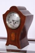 An Edwardian mahogany inlaid balloon clo