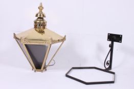 A contemporary large antique style brass