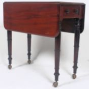 A Victorian Pembroke table standing on t