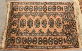 A pair of 20th century rugs, one being a