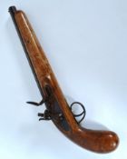 A 19th century flintlock pistol with car