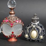 A pair of contemporary white metal and c