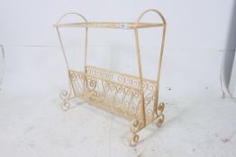 A retro 1950's painted metal magazine ra