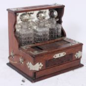 A mid-20th century tantalus containing 3