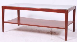A retro 1960's teak and glass coffee tab