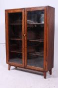 A 1930's oak bookcase display cabinet ha