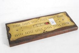 A good 19th century oak and brass crib /