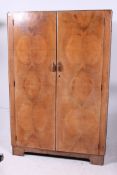 A 1930's Art Deco walnut double door war