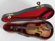 A miniature violin and box complete with