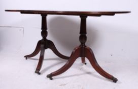 A Regency mahogany inlaid pedestal table