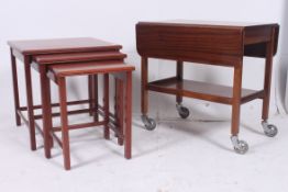 A contemporary mahogany nest of tables a
