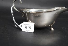 A hallmarked silver cream jug, with hall