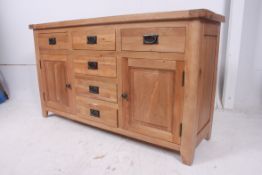 A contemporary oak chunky sideboard havi