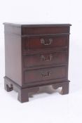 A Regency style mahogany side cabinet ha