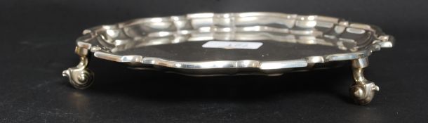 A silver hallmarked salver having scallo