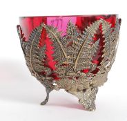 A silver plate and cranberry glass bon b