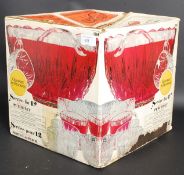 A retro glass punch bowl with punch glas