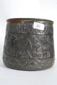 An early 20th century hammered copper pl