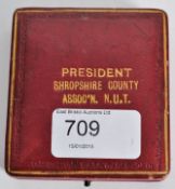 Silver gilt and enamel N.U.T. medal for