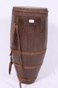 A large wooden African drum together wit