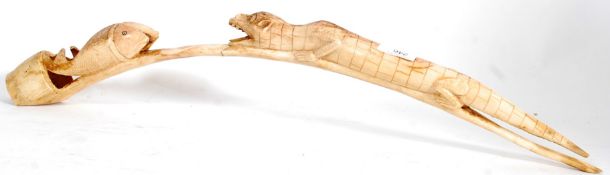 A carved 20th century bone in the form o