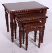 A contemporary mahogany nest of 3 gradua