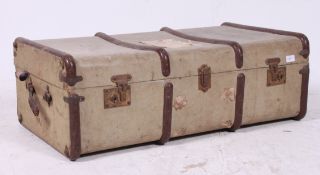 An early 20th century canvas and wooden