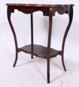 An Edwardian mahogany side table raised