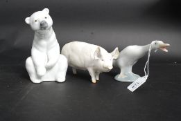 A Lladro Polar Bear with a Lladro Goose