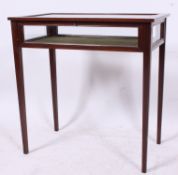 An Edwardian oak cased bijouterie table