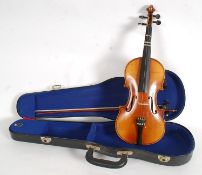 A vintage Boosey & Hawkes violin, in lat