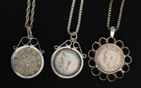 A collection of three white metal (stamp